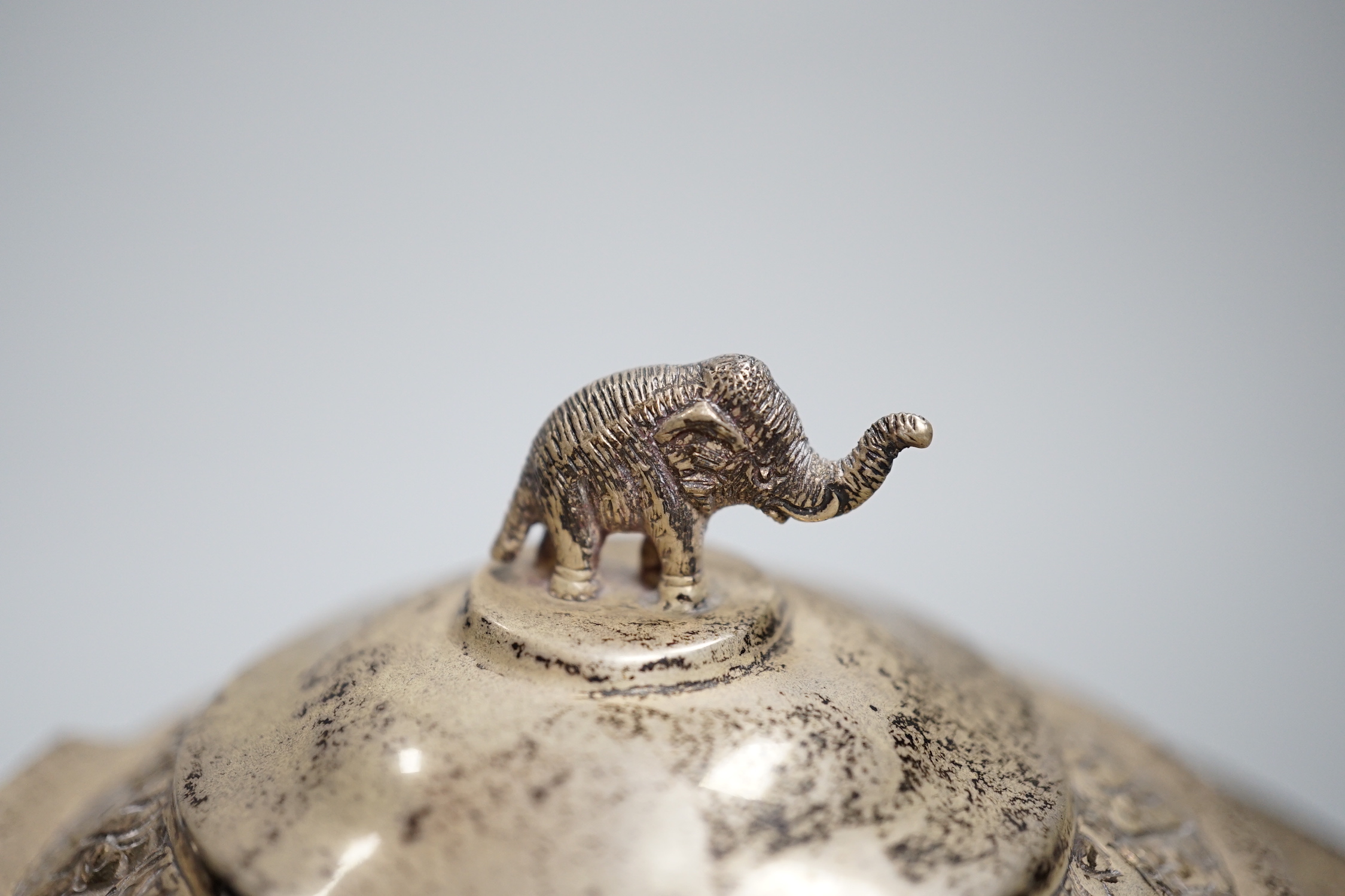 A Thai white metal five piece coffee service, decorated with figures and elephants, tray 31cm, CITES Submission reference G3XAWY7Y
